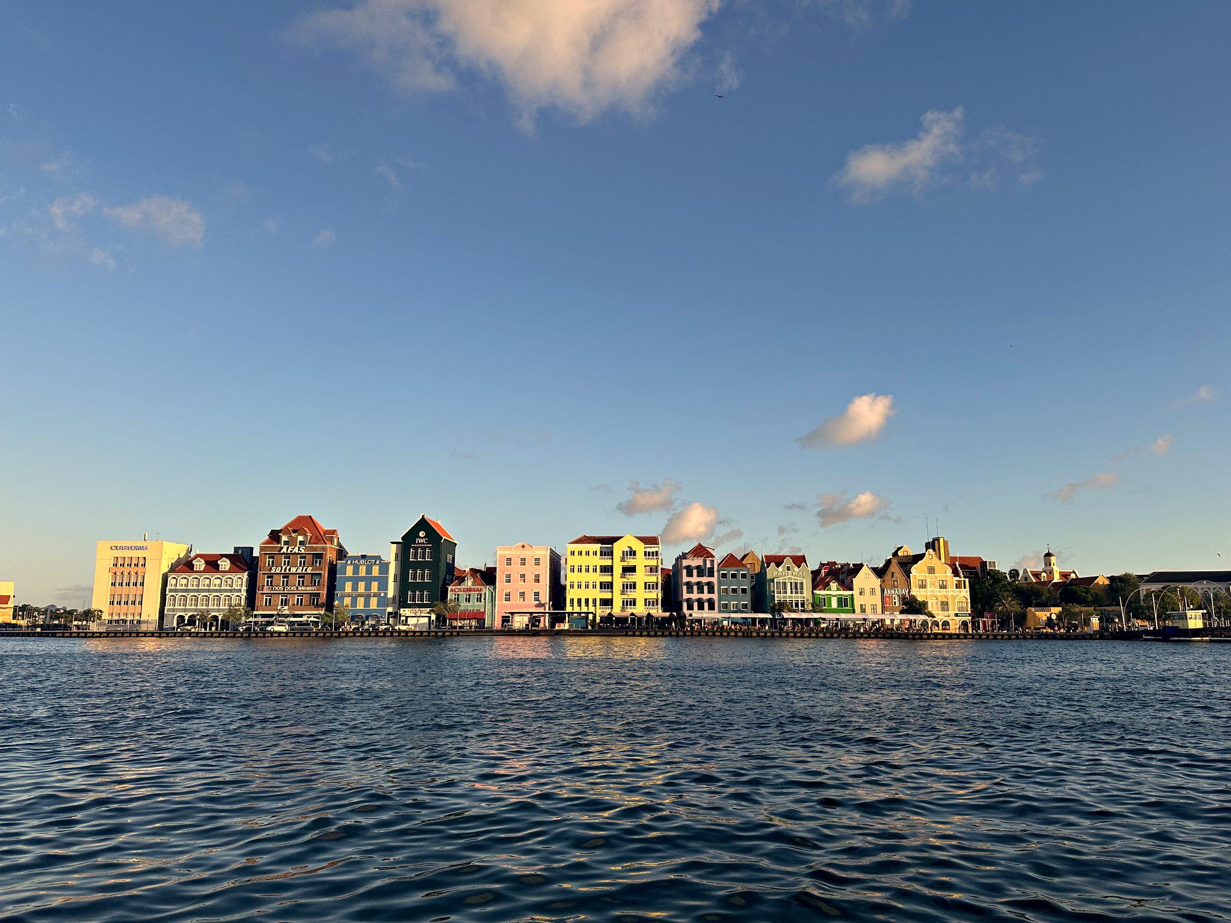 Pastel colonial buildings of Handelskade, Punda, seen across the water
